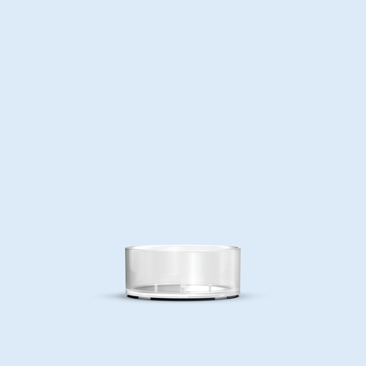 clear Mini Tea Light plastic candle container on light blue background