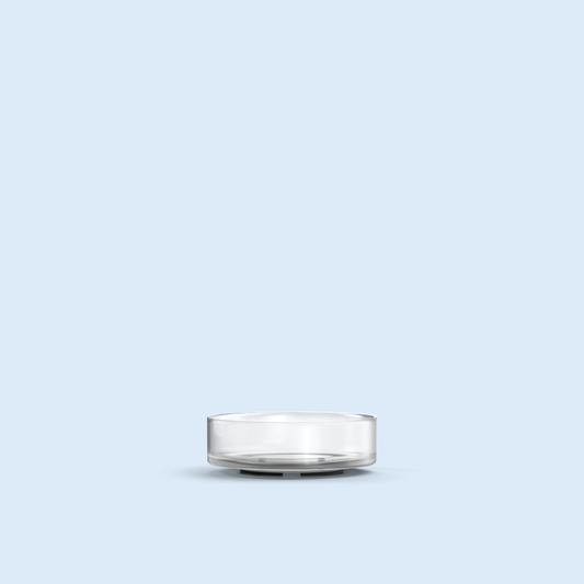 clear Nano Tea Light plastic candle container on light blue background