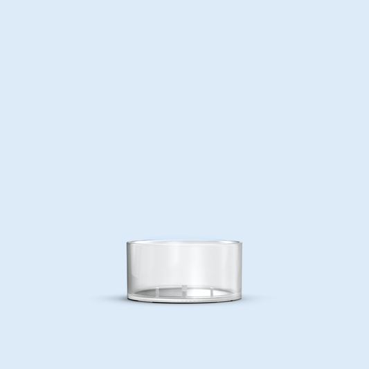 clear Tea Light plastic candle container on light blue background