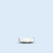 clear Nano Tea Light plastic candle container on light blue background