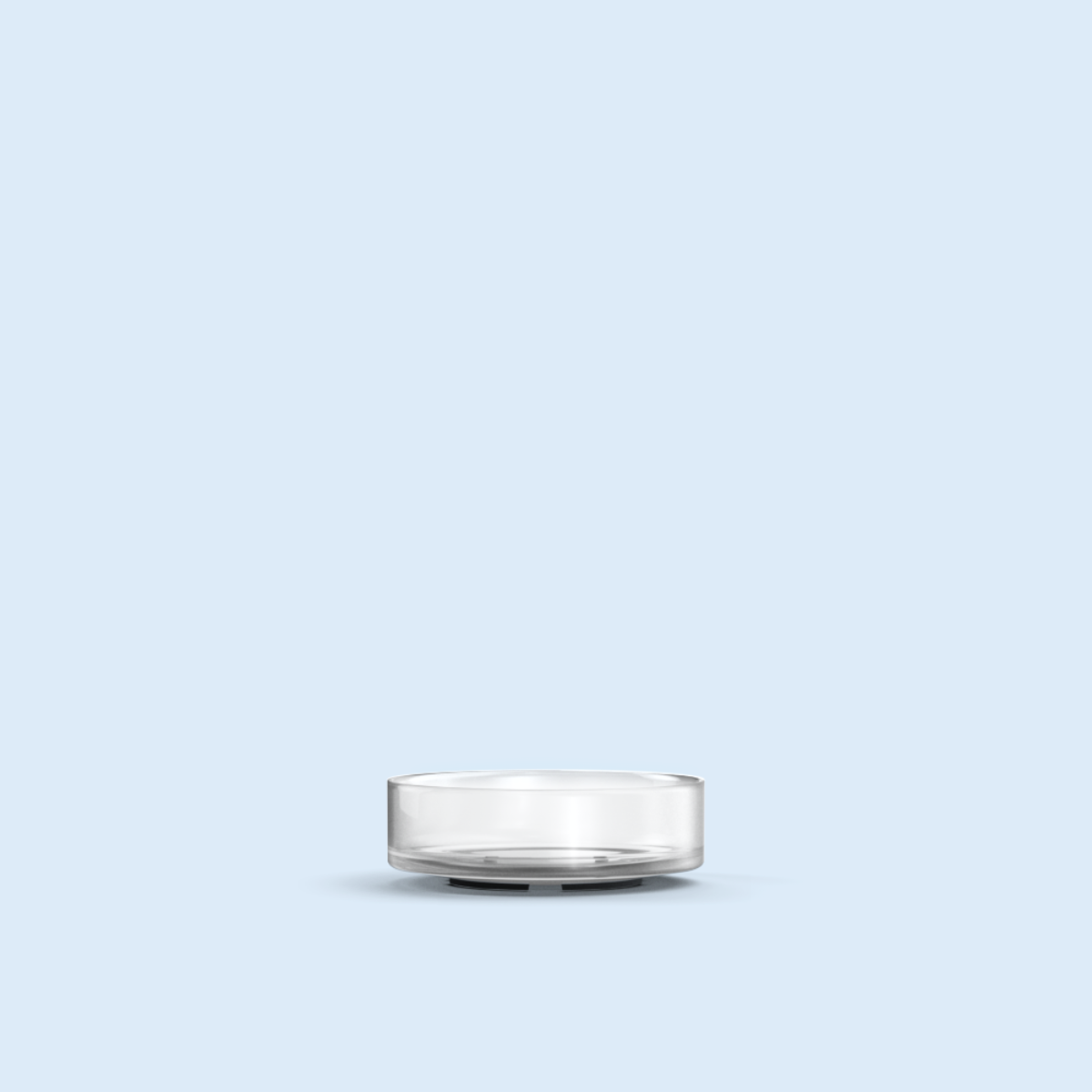 clear Nano Tea Light plastic candle container on light blue background