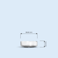 clear Nano Tea Light plastic candle container on light blue background, with width and height measurements in millimeters