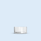 clear Tea Light plastic candle container on light blue background