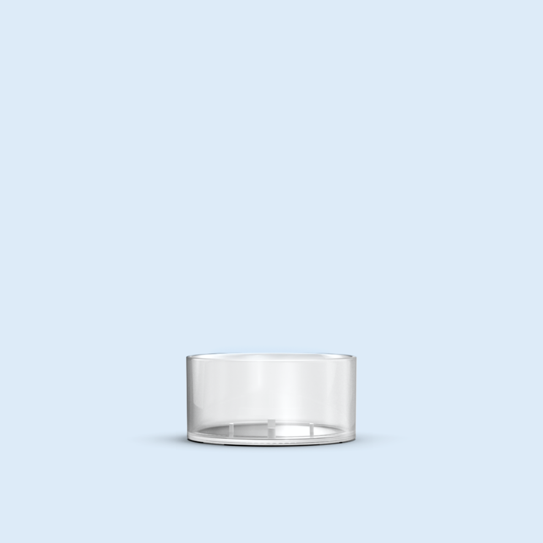 clear Tea Light plastic candle container on light blue background