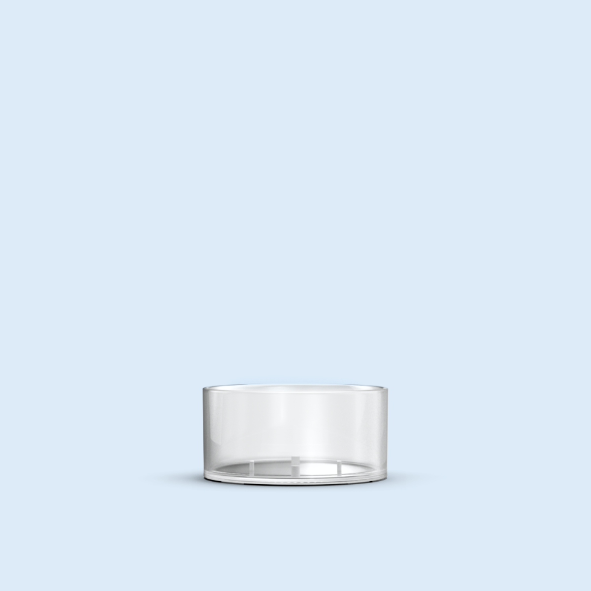 clear Tea Light plastic candle container on light blue background